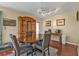 Dining room with hardwood floors, dining table, and a vintage hutch at 2440 Ednor St, Port Charlotte, FL 33952