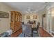 Dining room featuring hardwood floors, dining table and vintage hutch at 2440 Ednor St, Port Charlotte, FL 33952