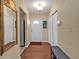 View of the home's entryway featuring tile flooring, a closet and a white front door at 2440 Ednor St, Port Charlotte, FL 33952
