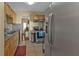 Kitchen with stainless steel appliances, tile flooring and tan walls at 2440 Ednor St, Port Charlotte, FL 33952