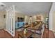Spacious living room with hardwood floors, comfortable seating, and a modern entertainment center at 2440 Ednor St, Port Charlotte, FL 33952