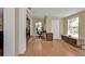 Bright living room with wood floors, neutral paint, and desk area at 2440 Ednor St, Port Charlotte, FL 33952
