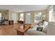 Bright living room with natural light, with hardwood floors and a view of the front yard at 2440 Ednor St, Port Charlotte, FL 33952