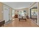 Cozy living room with wood floors, comfortable seating, and natural light creates a warm, inviting atmosphere at 2440 Ednor St, Port Charlotte, FL 33952