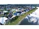 Aerial view of the home, showcasing the landscaped lot and lakeside setting at 26287 Stillwater Cir, Punta Gorda, FL 33955