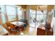 Bright breakfast nook features tile flooring, a view to the lanai, and stylish Tiffany-style lighting at 26287 Stillwater Cir, Punta Gorda, FL 33955