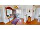 Welcoming foyer with hardwood floors, decorative mirror and console table at 26287 Stillwater Cir, Punta Gorda, FL 33955