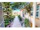 Inviting front entrance with a landscaped walkway and charming details at 26287 Stillwater Cir, Punta Gorda, FL 33955