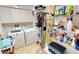 Functional laundry room with ample shelving, washer, and dryer at 26287 Stillwater Cir, Punta Gorda, FL 33955