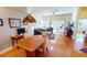 Spacious living room with wood floors, lake views, and access to an outdoor patio at 26287 Stillwater Cir, Punta Gorda, FL 33955