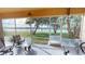 Enclosed screened patio overlooking a serene lake view, great for relaxing and entertaining at 26287 Stillwater Cir, Punta Gorda, FL 33955