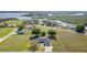 Aerial view of a home situated on a spacious lot, near a river and lush greenery at 31093 N Bend St, Punta Gorda, FL 33982