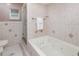 Bathroom boasts a soaking tub, shower, tile floor, and neutral decor at 31093 N Bend St, Punta Gorda, FL 33982