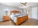 Spacious bedroom with wood furniture, tiled floor and a ceiling fan at 31093 N Bend St, Punta Gorda, FL 33982
