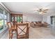 An open-concept space combining dining and living areas, featuring tile flooring and neutral color tones at 31093 N Bend St, Punta Gorda, FL 33982