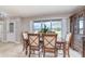 The dining room has a large window to the backyard, tile flooring, and natural light at 31093 N Bend St, Punta Gorda, FL 33982