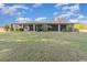Back of house featuring a very large, screened in porch with views of a huge lawn at 31093 N Bend St, Punta Gorda, FL 33982