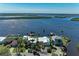 Beautiful waterfront home featuring lush landscaping, private boat docks and easy access to the bay at 3790 Peace River Dr, Punta Gorda, FL 33983