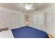 Bedroom features wood floors, white walls and a ceiling fan at 3790 Peace River Dr, Punta Gorda, FL 33983