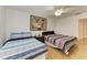 Spacious bedroom featuring two beds and a large wall decoration at 3790 Peace River Dr, Punta Gorda, FL 33983