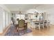 Bright dining area with an rustic table and chairs with an island and gourmet kitchen at 3790 Peace River Dr, Punta Gorda, FL 33983
