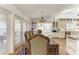 Charming dining area with natural light and a view of the outdoor deck at 3790 Peace River Dr, Punta Gorda, FL 33983