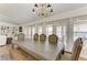 The rustic dining table highlights the dining area's charm, complemented by water views at 3790 Peace River Dr, Punta Gorda, FL 33983