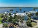 Charming home featuring lush landscaping, mature trees, and a well-manicured yard at 3790 Peace River Dr, Punta Gorda, FL 33983