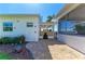 Outdoor patio with a grill, buddha statue, and a view of the water at 3790 Peace River Dr, Punta Gorda, FL 33983