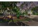 Charming home with lush tropical landscaping, mature palm trees, and a well-maintained front yard at 3790 Peace River Dr, Punta Gorda, FL 33983
