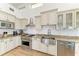 Charming kitchen featuring neutral cabinets, granite countertops, and stainless steel appliances at 3790 Peace River Dr, Punta Gorda, FL 33983
