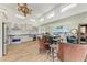 Bright, open kitchen and dining room with stainless steel appliances, neutral cabinets and light wood floors at 3790 Peace River Dr, Punta Gorda, FL 33983