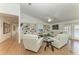Bright living room with white couches, hardwood floors and built-in shelving at 3790 Peace River Dr, Punta Gorda, FL 33983