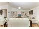 A living room with built-in shelving and white furniture, creating a cozy atmosphere at 3790 Peace River Dr, Punta Gorda, FL 33983