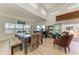A bright, airy living room featuring high ceilings, light wood floors, and an adjacent dining area at 3790 Peace River Dr, Punta Gorda, FL 33983
