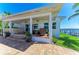 This stunning waterfront home features a covered patio with an outdoor kitchen and brick flooring at 3790 Peace River Dr, Punta Gorda, FL 33983