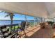 Enclosed patio showcases brick flooring, comfortable seating, and a beautiful waterfront view at 3790 Peace River Dr, Punta Gorda, FL 33983