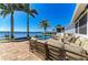 An expansive backyard pool and spa with plenty of lounge seating and views of the waterfront at 3790 Peace River Dr, Punta Gorda, FL 33983