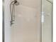 Clean and bright stand up shower with white tile and sliding glass door at 3790 Peace River Dr, Punta Gorda, FL 33983