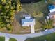 Overhead shot showcasing the home, its location near the water, and lush surroundings at 3940 Abbotsford St, North Port, FL 34287
