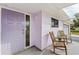 Inviting front porch offers a relaxing outdoor space with charming rocking chairs and a well-maintained exterior at 3940 Abbotsford St, North Port, FL 34287
