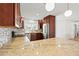 Well-lit kitchen with stainless steel appliances, granite counters, and mosaic tile backsplash at 3940 Abbotsford St, North Port, FL 34287