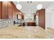 Updated kitchen featuring granite countertops, stainless appliances, and ample cabinet space at 3940 Abbotsford St, North Port, FL 34287