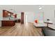 Spacious living area with kitchen, modern decor, and ample natural light at 3940 Abbotsford St, North Port, FL 34287