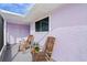 Relaxing screened porch featuring comfortable rocking chairs at 3940 Abbotsford St, North Port, FL 34287
