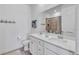 Modern bathroom featuring double sinks, sleek countertops, and a walk-in shower at 42210 Lake Timber Dr, Punta Gorda, FL 33982