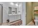 Elegant bathroom with dual sinks and a neutral color palette at 42210 Lake Timber Dr, Punta Gorda, FL 33982