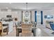 Open floor plan combining kitchen, dining area, and living space with stylish furnishings at 42210 Lake Timber Dr, Punta Gorda, FL 33982