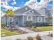 Charming one-story home boasts lush landscaping, well manicured lawn, and a welcoming walkway leading to the front door at 42210 Lake Timber Dr, Punta Gorda, FL 33982