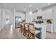 Bright kitchen with white cabinetry, stainless steel appliances, and an island with bar seating at 42210 Lake Timber Dr, Punta Gorda, FL 33982